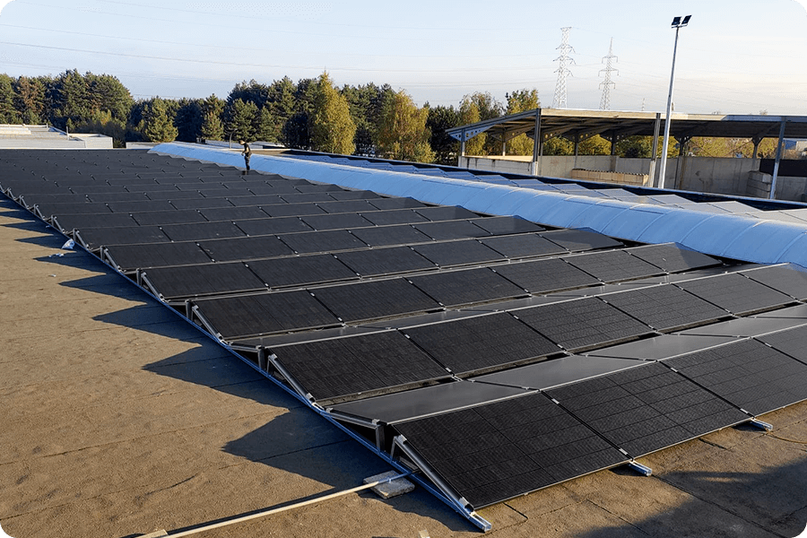 Ground-mounted PV system using horizontal layout to reduce shading losses from low-angle morning and evening sunlight.