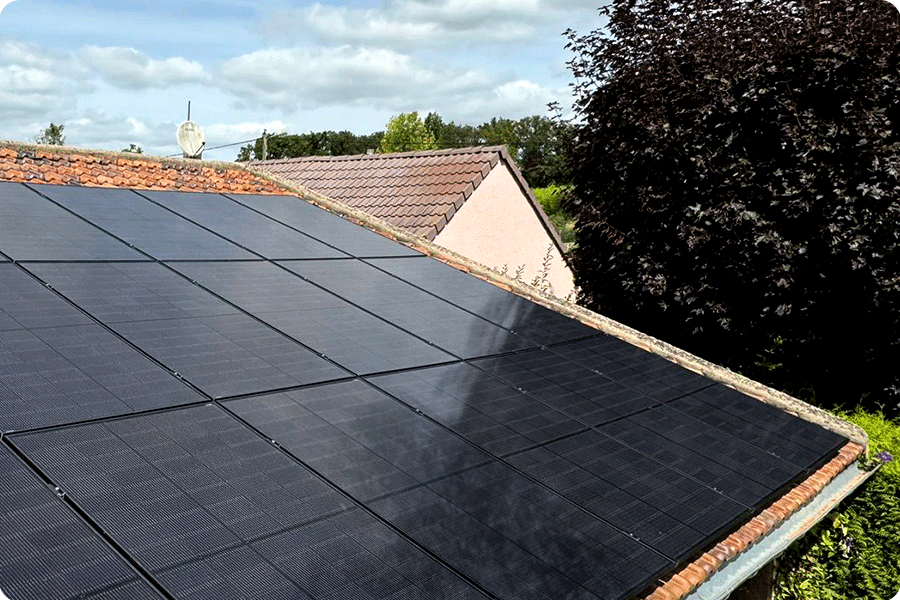 Rooftop PV modules shaded by nearby trees, with power output reduced under low-angle sunlight