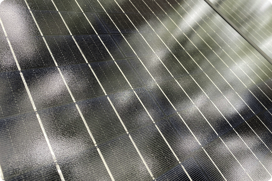 Close-up view of a photovoltaic solar cell, showing densely distributed silver paste conductive gridlines on the cell surface—the first critical manufacturing stage to be affected by rising silver prices.