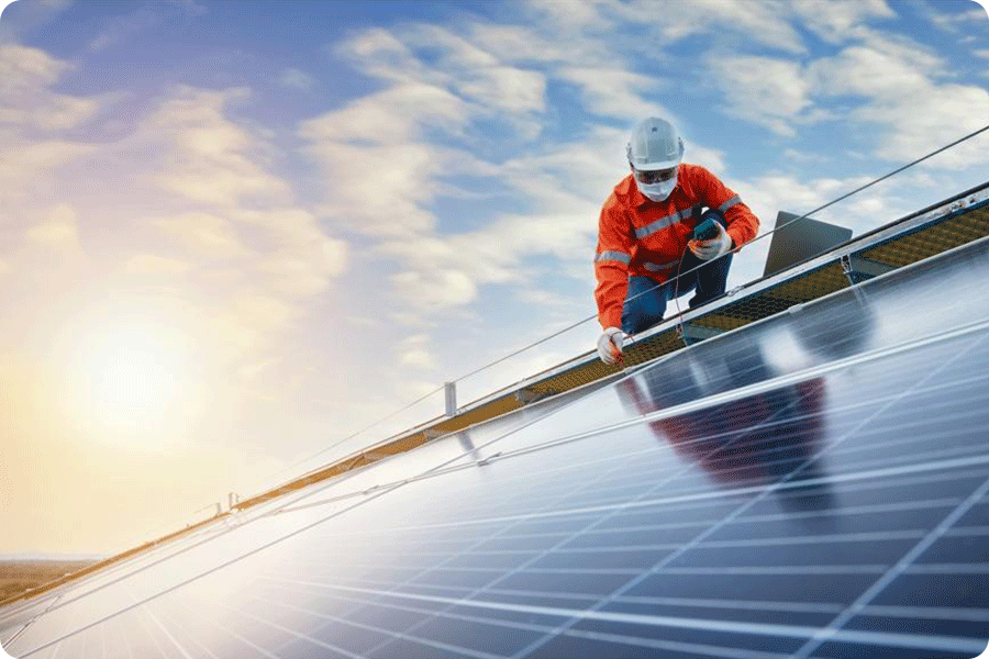 Technicians installing photovoltaic modules on a rooftop, illustrating the importance of long-term reliability and safety certification in project selection