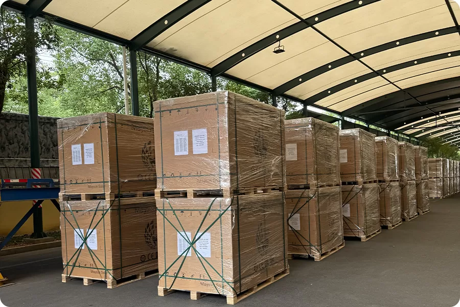 Solar panel pallets in a European warehouse, supporting corporate project delivery and follow-up replenishment.